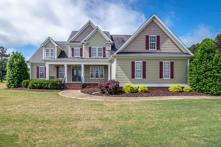 Suburban New Orleans area home exterior showing the full roofline