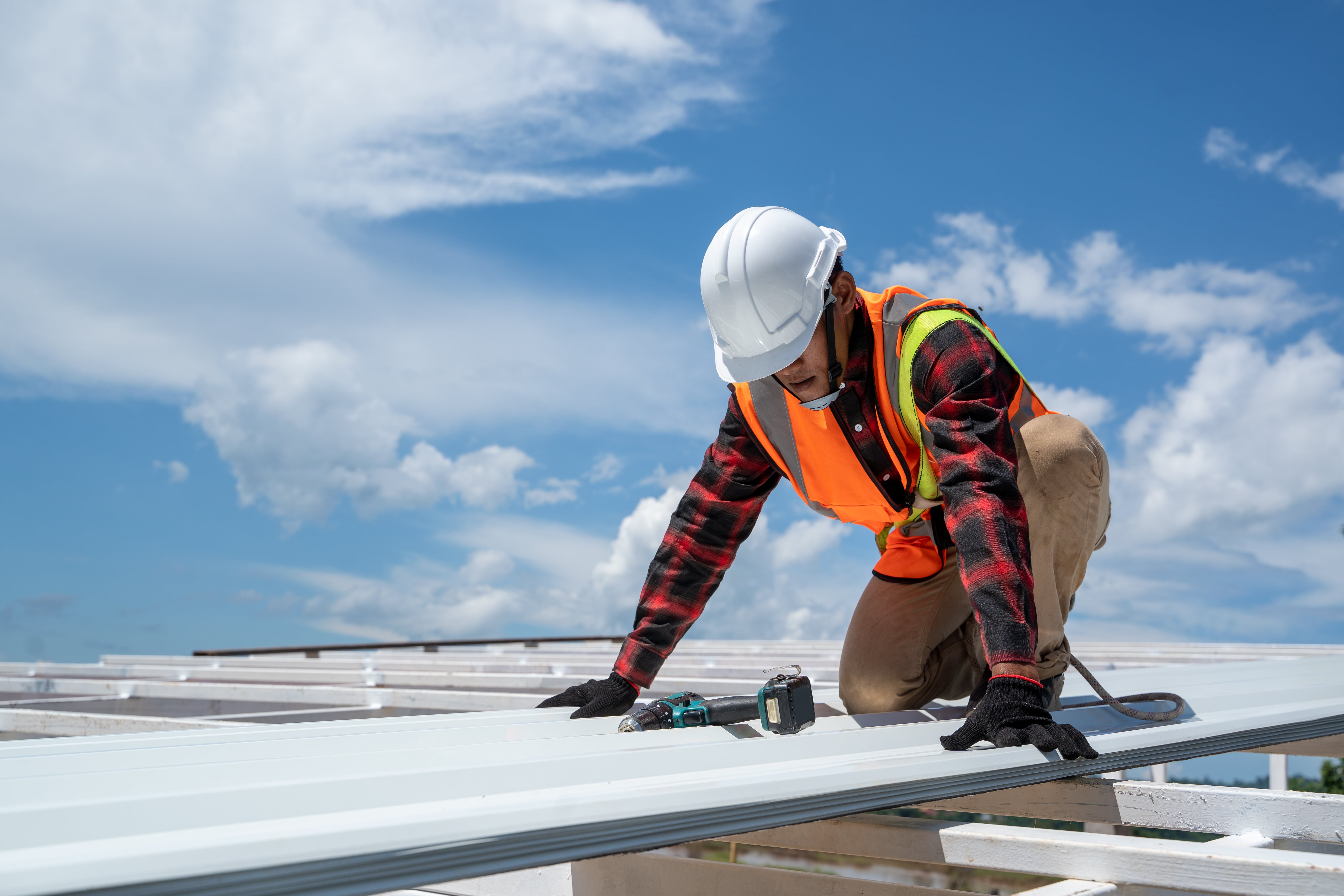 roofing worker installing new roof