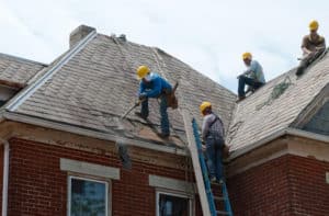 workers removing old roof
