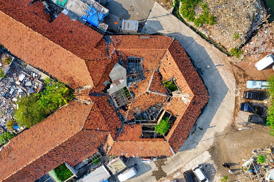 Drone aerial view of a roof during a thermal inspection used to document storm damage for an insurance claim