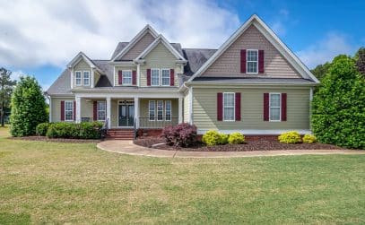 Suburban New Orleans area home exterior showing the full roofline