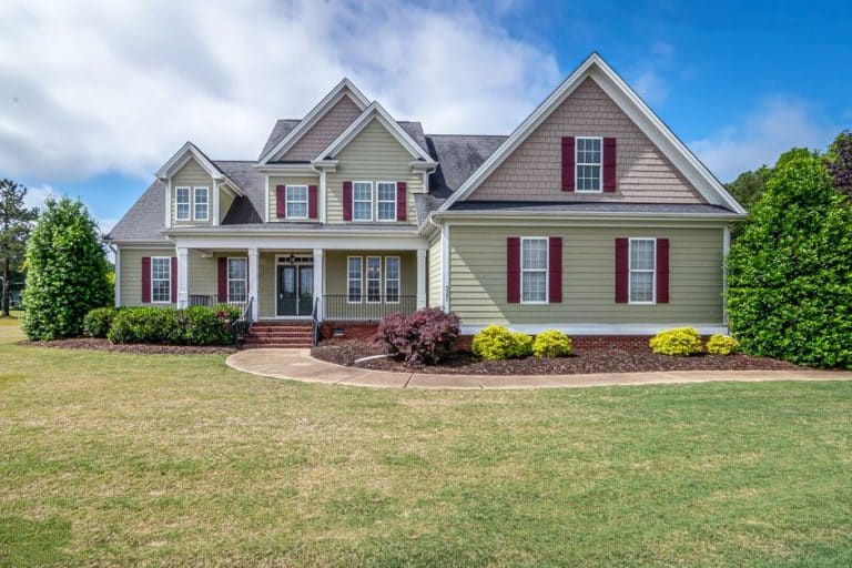 Suburban New Orleans area home exterior showing the full roofline